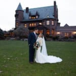 Caitlin & Chad posing outside Belhurst.