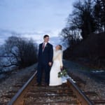 Caitlin & Chad posing on the railroad tracks.