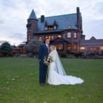 Caitlin & Chad posing outside Belhurst.