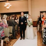 Amanda walking down the aisle with her father.