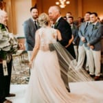 Amanda arriving at the altar with her father and Dan.