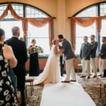 Amanda and Dan kissing at wedding.