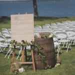 Outdoor wedding ceremony setup. Sign text: Welcome to our unplugged ceremony, We invite you to be fully present and enjoy the moment with us, please turn off all cell phones, cameras and gadgets, We promis to share photos our amazing photographer captures today, thank you.