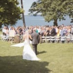 Kelsey walking down the aisle with her father.