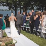 Kelsey walking down the aisle with her father.