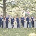 Kelsey and Jared posing with the wedding party.