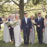 Kelsey and Jared posing with the wedding party.