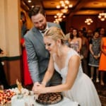 Amanda and Dan cutting the wedding cake.