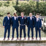 Shu and the groomsmen on the dock.