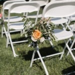 Wedding chairs with boguets.