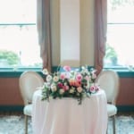 Meritage Ballroom - Wedding reception table flower decorations.