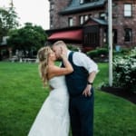 Liz and Bill kissing outside Belhurst.