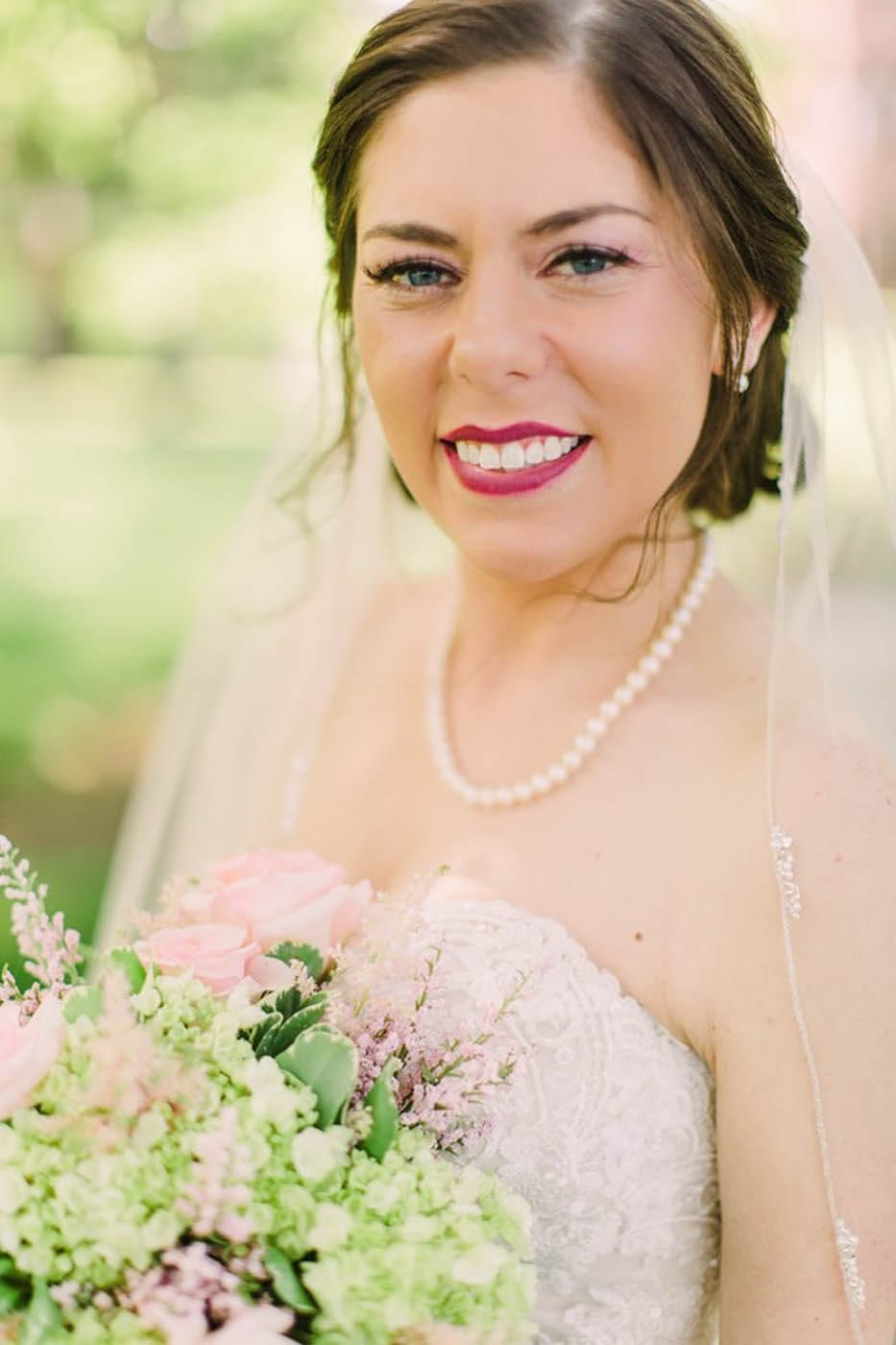 Bride posing with bouquet.