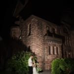 Melissa & Marcin posing outside Belhurst at night.