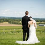 Melissa and Marcin posing in the field.