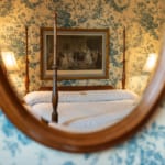 Clay Room - Mirror with bed reflected.