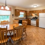 Dwyer Lane House - Dining table and kitchen.