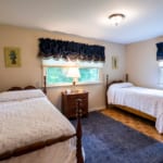 Dwyer Lane House - Bedroom with two beds.