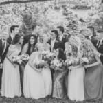 Kelsey and Jared posing with the wedding party.