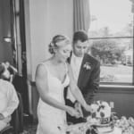 Kelsey and Jared cutting the wedding cake.