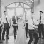 Kelsey dancing with the groomsmen.