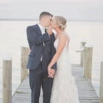 Kelsey and Jared kissing on the dock.