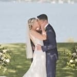 Kelsey and Jared kissing at their wedding.