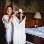 Haley holding her wedding dress.