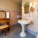 Nicholas Room - Bathroom with sink and vanity table. Nicholas Room - Bathroom with sink and vanity table.