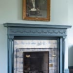 Nicholas Room - Fireplace with painting above. Nicholas Room - Fireplace with painting above.