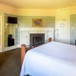 Pondview Room - bed, fireplace and jacuzzi tub.