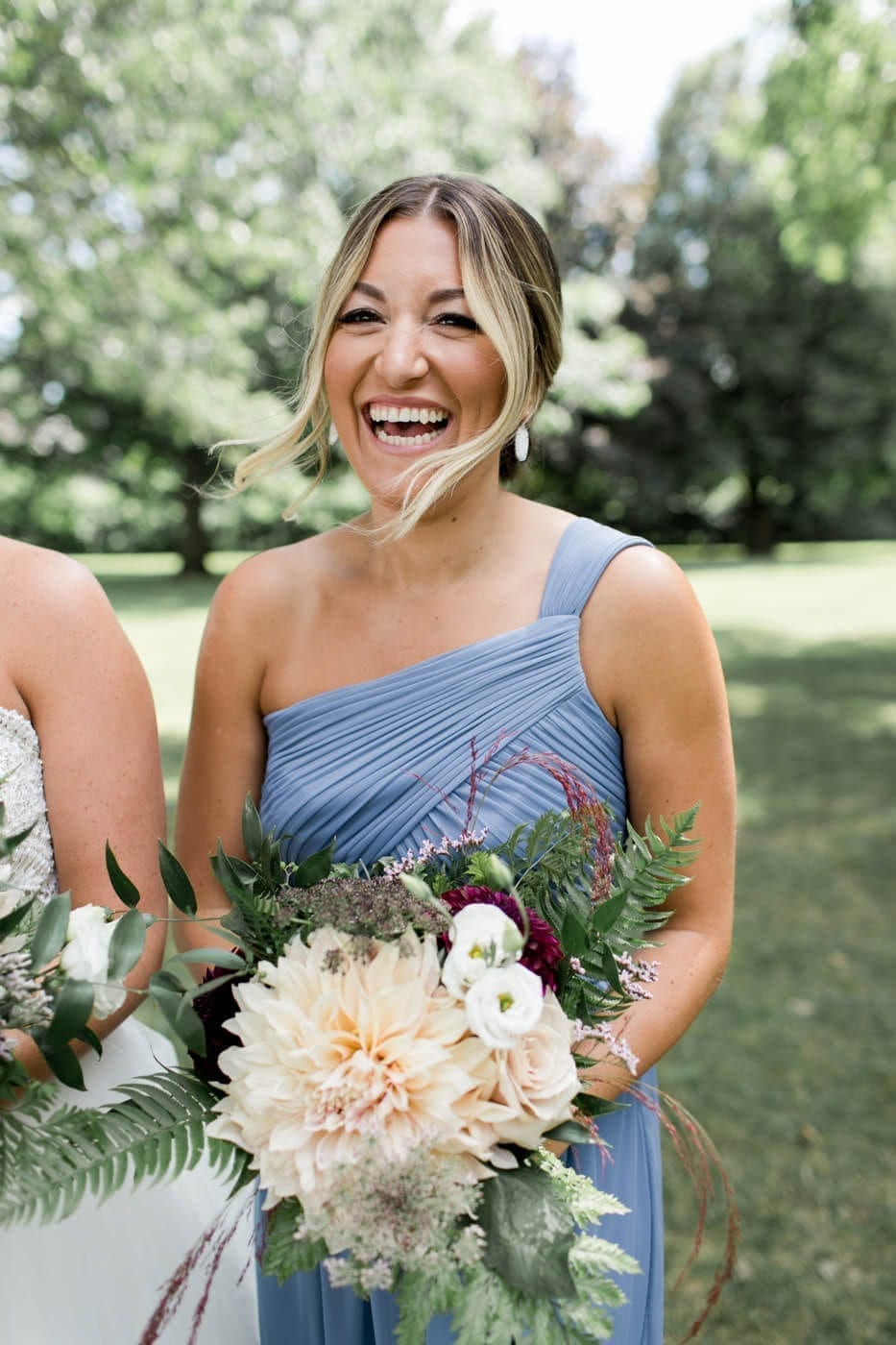 Bridesmaid with bouquet.