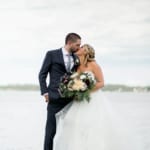 Shannon and Nick kissing on the dock.