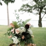Ceremony decorations: flowers on a barrell.
