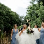 Shannon and her bridesmaids posing outside.