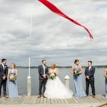Shannon and Nick with the wedding party on the dock.