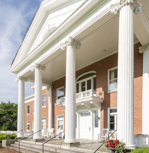 Closeup of pillars at the front of White Springs Manor.