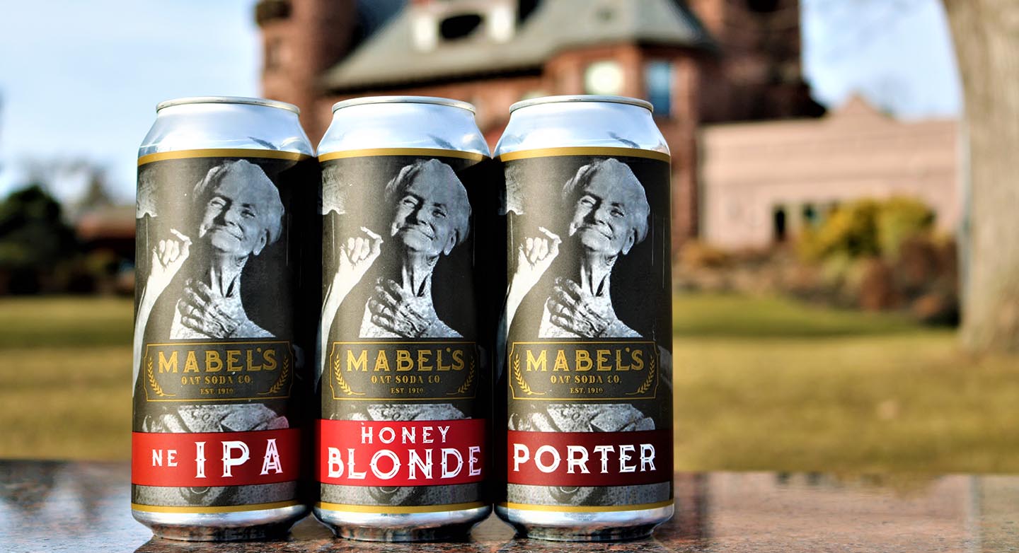 Mabel's Oat Soda cans. Text: NE IPA, Honey Blonde, Porter.
