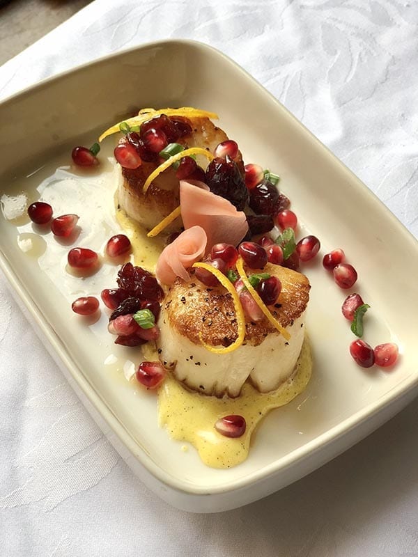 Scallops and pomegranate seeds.